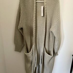 SELLING NEVER WORN CARDIGAN ONE SIZE WITH TAGS ON!